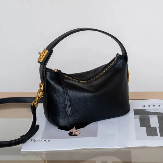 Sac à bandoulière en cuir pleine fleur pour femmes.